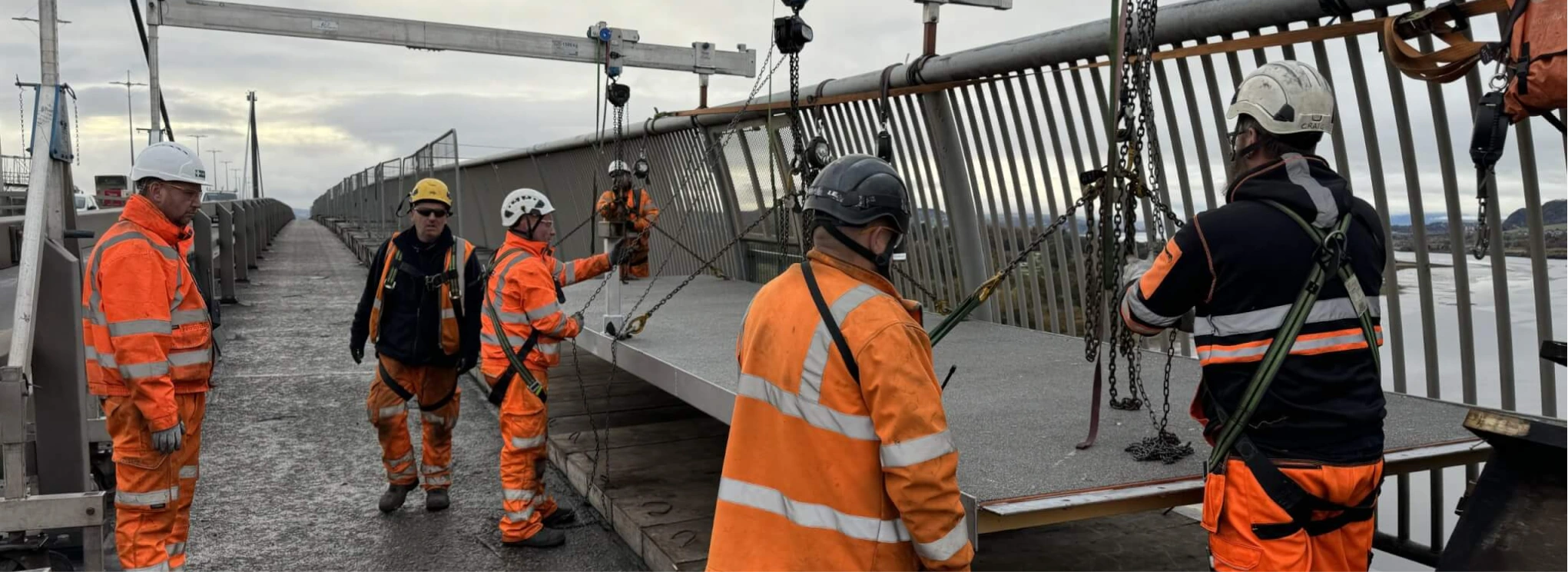 Spencer Bridge Engineers putting down floor panels
