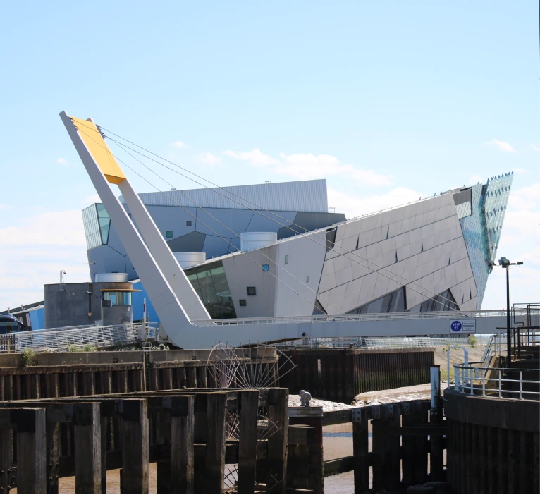 Photo of the Deep Rotating Footbridge with the Deep in the background