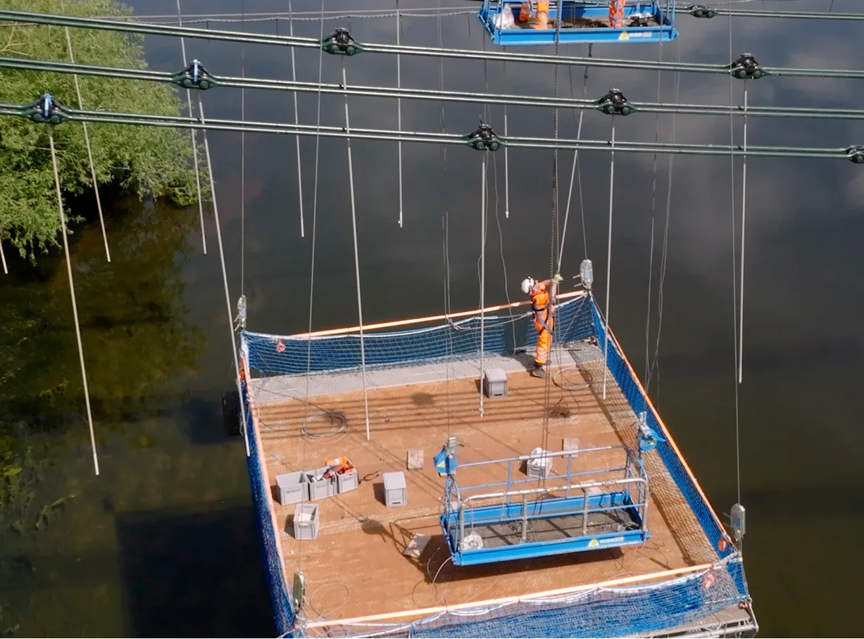 Closer drone shot of Spencer Bridge Engineers working on Union Chain bridge