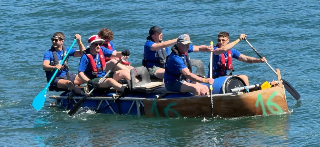 Image of some of the Spencer Bridge Engineering colleagues on their raft - taking part in the Great Strait Raft Run in Anglesey to raise money for the Menai Heritage Museum.